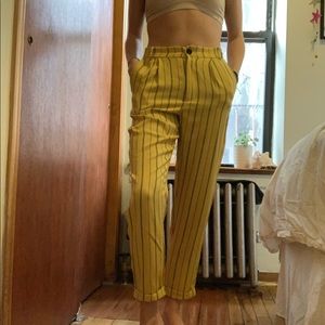 Yellow striped high waisted trousers.